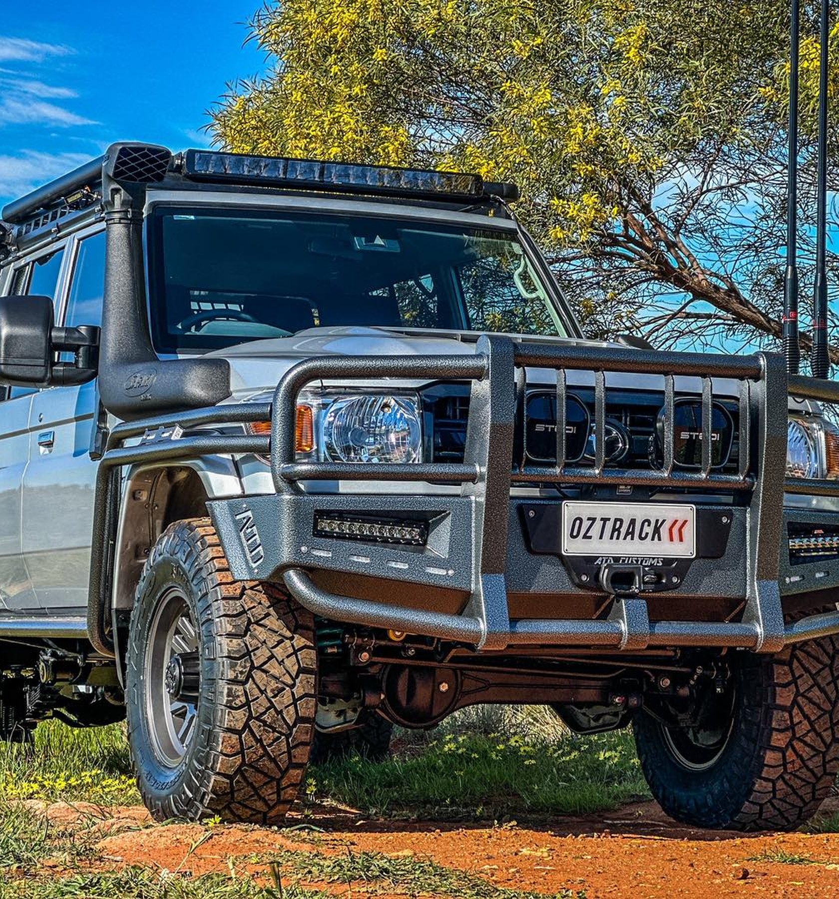 Custom-built OzTrack four-wheel drive with canopy on red dirt